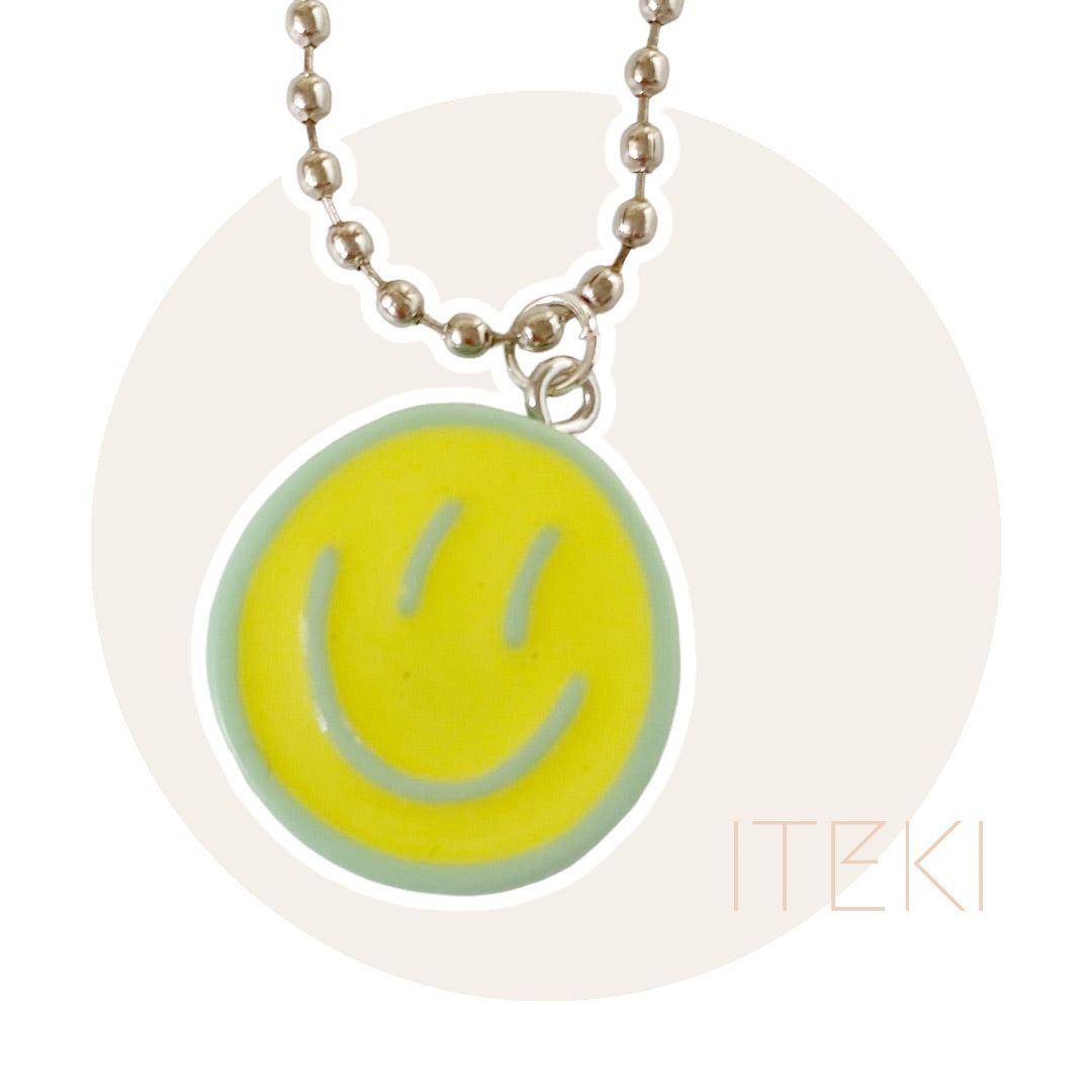 Sneaker chain smiley geel/groen